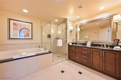 Bathroom featuring double vanity, a garden tub, a