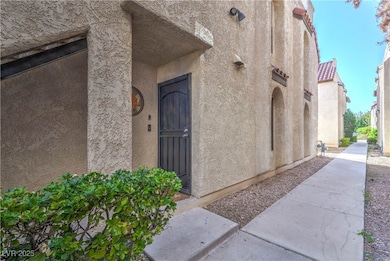 Entrance to property with stucco siding