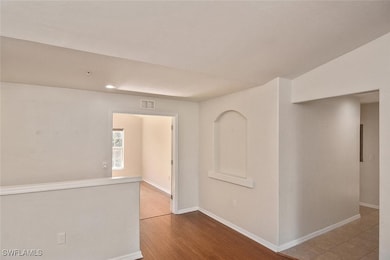 Unfurnished room with baseboards, recessed lightin