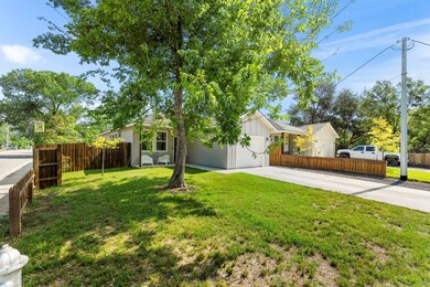 View of front of home with concrete driveway, a g