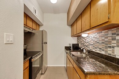 Kitchen with stainless steel appliances, under ca
