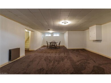 Spacious lower level recreation room features bran