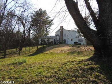 Exterior Back - View from lower side yard