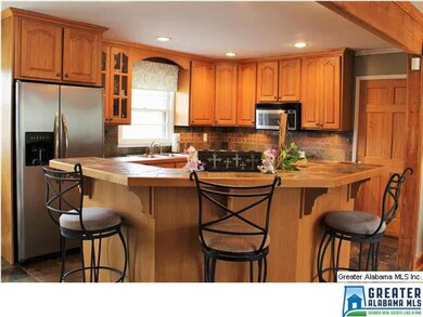 Large Island Bar with slate countertops and floori