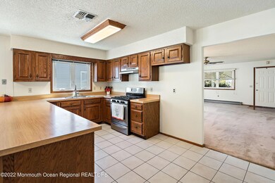 09-Kitchen to Living and Foyer