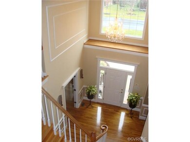 Gorgeous 2-story foyer, crown molding, chair rail,