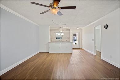 View from the Florida Room towards Kitchen - Newer Floring throughout the home, New Baseboards - Very Bright, Open Floor Plan.