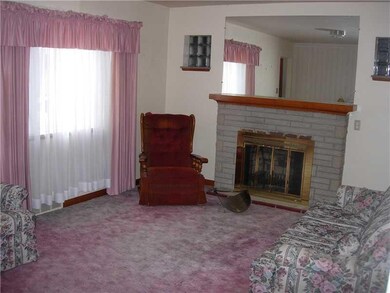Living Room. hardwood flooring under carpet