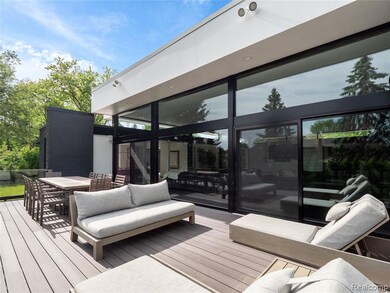 Wooden terrace featuring outdoor dining space and an outdoor living space