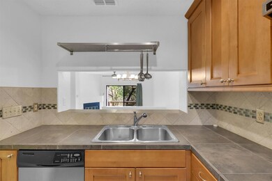 Kitchen featuring decorative backsplash, dishwash