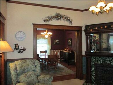 Family room with original tiled decorative firepla