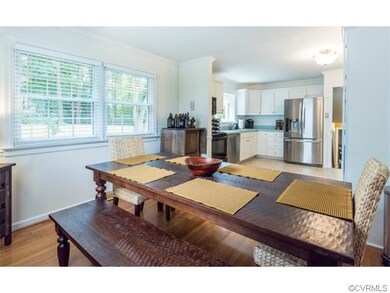 Spacious dining room, open to kitchen and full of 