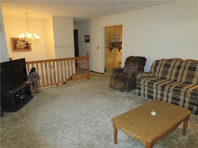 There is a Custom Oak Railing bordering the Living