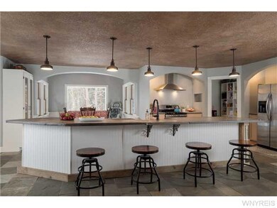 Kitchen. The island breakfast bar is perfect for e