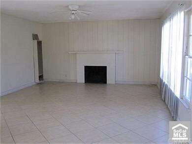 Very spacious living room with with all tile floor
