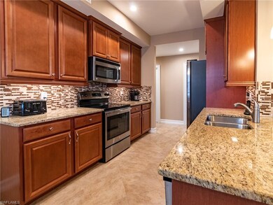 Granite counter tops, matching stainless steel appliances, and a beautiful backsplash to pull it together