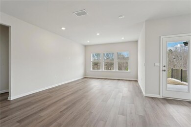 Unfurnished living room with wood finished floors,