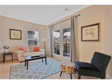 Living Room with crown molding; low windows provid