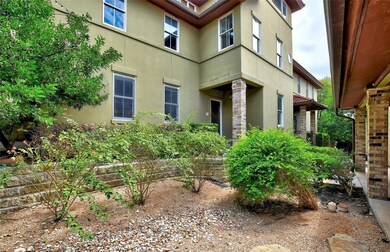 Entrance to property with stucco siding