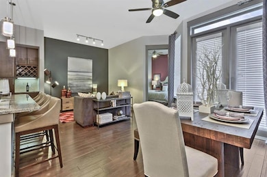 Dining area with dark hardwood / wood-style floors
