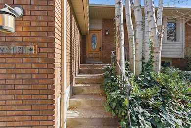 Doorway to property with brick siding