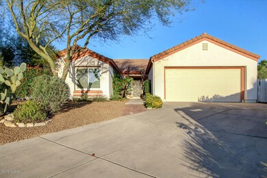 Front of home with longer driveway