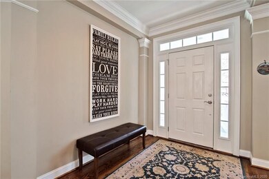 Entry with neutral colors, beautiful hardwood floo