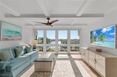 Sunroom featuring beam ceiling and a healthy amoun