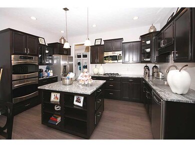 Kitchen. Home is under construction.  Photo is of a similar model.