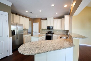 The chef's kitchen is well equipped with stainless