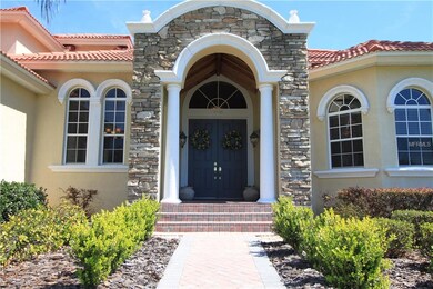 Stacked stone surrounds the front entrance, double
