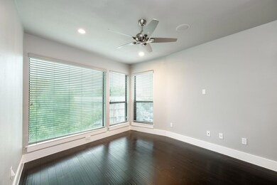 Unfurnished room featuring a ceiling fan, baseboa