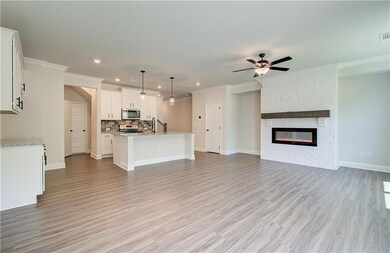 Unfurnished living room featuring light wood-style