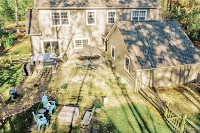 Exterior space with a lawn and a patio area