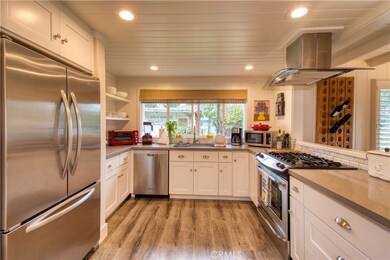 Kitchen with large window overlooking the yard
