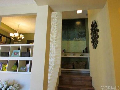Stairs up to the kitchen, formal dining room and b