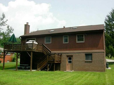 Exterior Back. Below deck are sliding doors into f