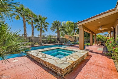 View of pool with a fenced backyard, a fenced in p