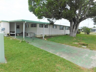 Second driveway on side of home.