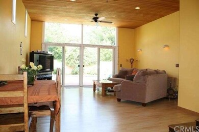 Great Room with wood ceilings, wall-mounted lighti
