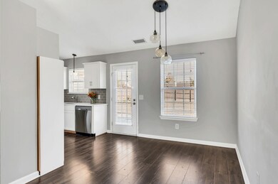 Dining room accommodates trestle or farmhouse table with seating for up to 8. Exterior door leads to back deck and yard.