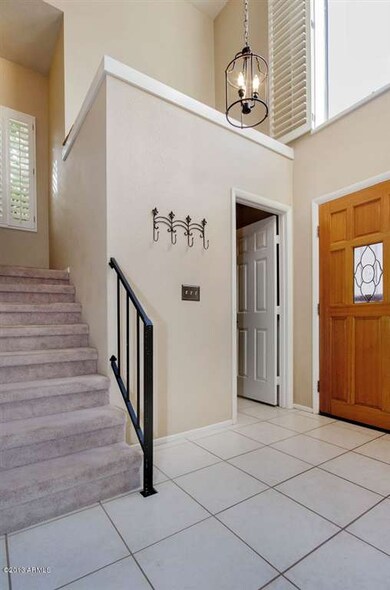 Dramatic foyer with soaring  ceilings