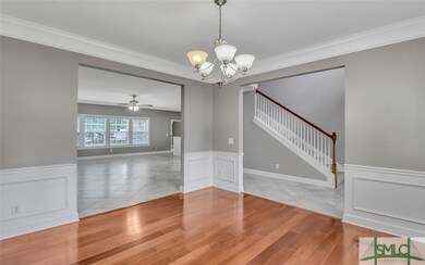 Formal Dining Room Boasts Beautiful Hardwood Floor