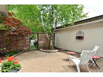 Private courtyard with newer brick paver patio.