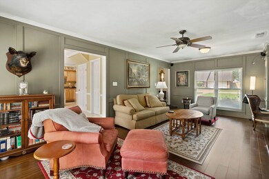 Living room featuring a decorative wall, ornamenta