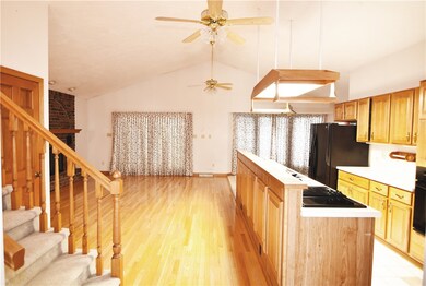 Entry to open floor plan, kitchen and living room