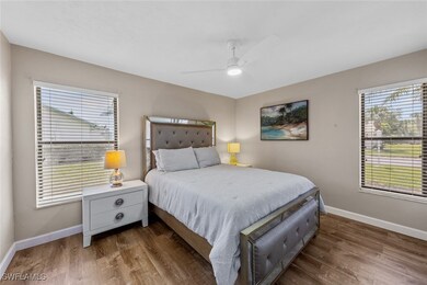 Second bedroom featuring ceiling fan, baseboards,