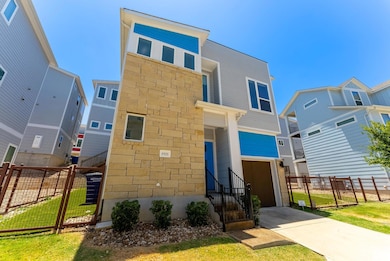 Modern home featuring concrete driveway, a garage