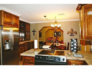 Kitchen. Notice built-in wine rack cabinet next to