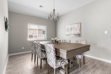 This is a bright dining room featuring a large woo